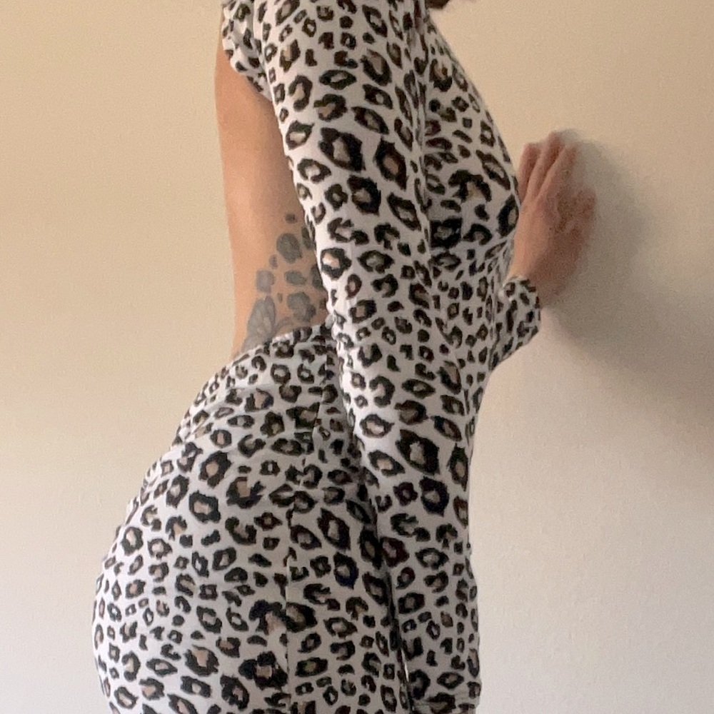 Long fitted dress with back out. No buttons or zipper.